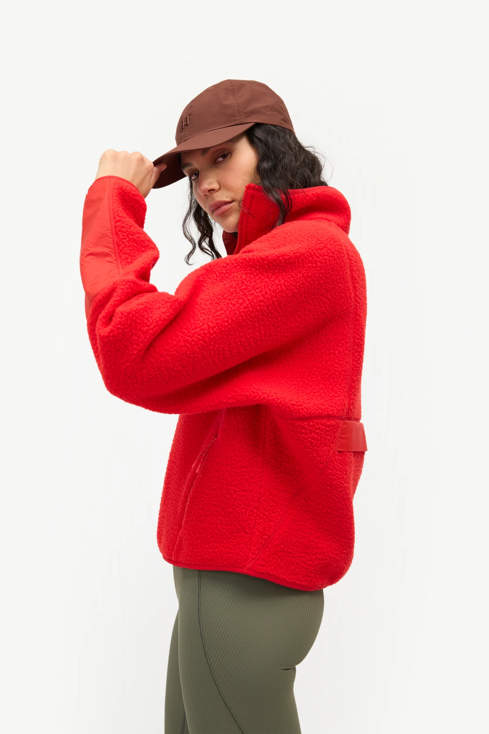 Red Pieper Fleece worn with olive leggings