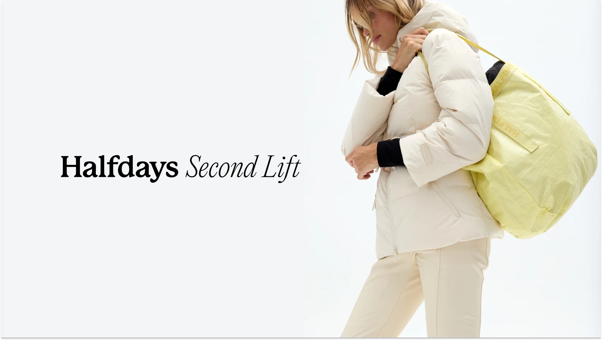 Halfdays Second Lift banner with a woman in a cream puffer holding a yellow bag