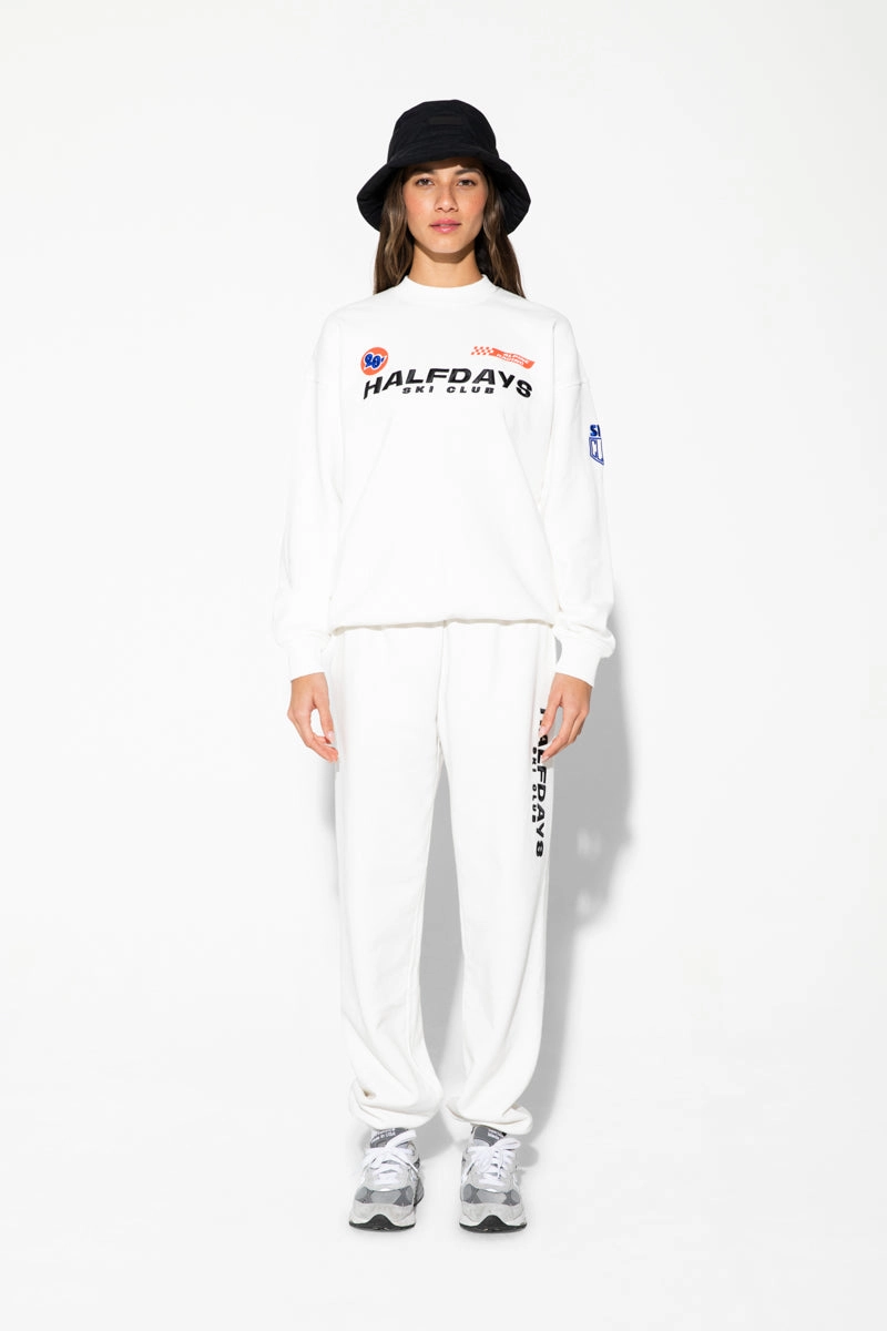 White Halfdays Ski Club sweatshirt worn with white pants