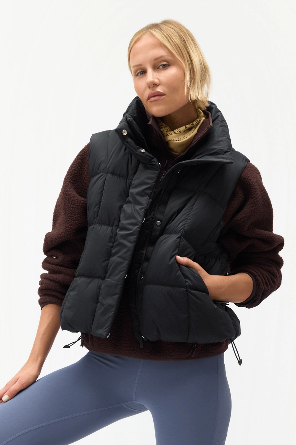 Black Louise Down Vest worn with blue leggings